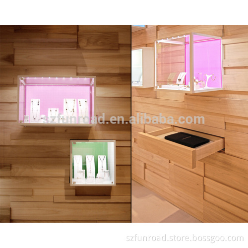Customized wall mounted glass cubes in different colors for jewel display
